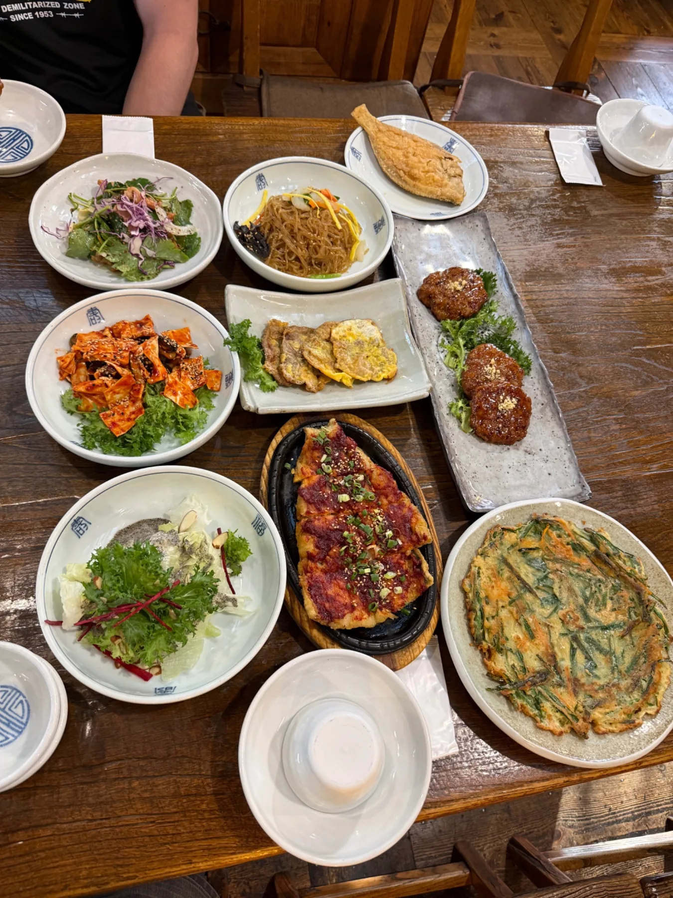 A table of Korean dishes shared during the program