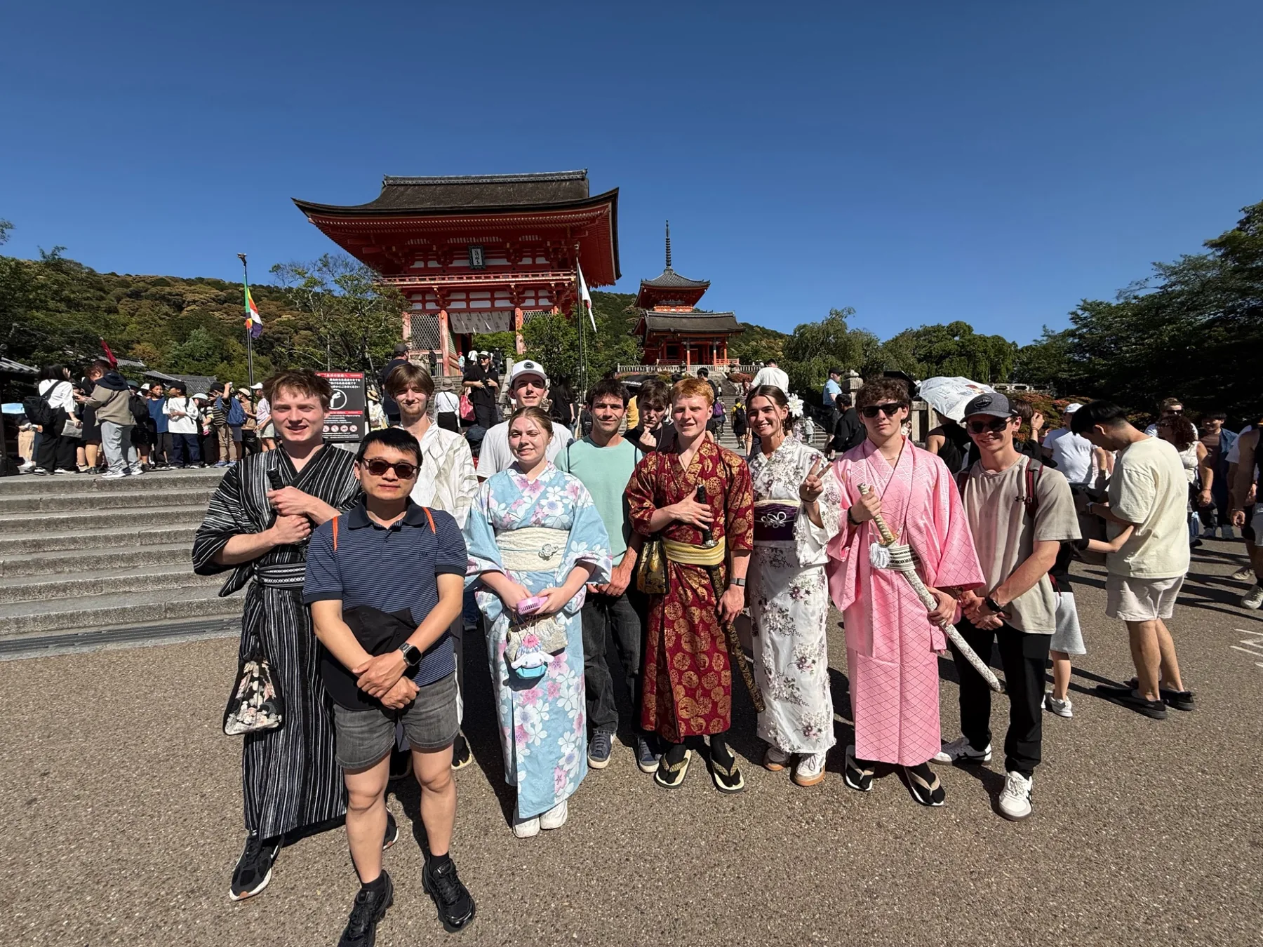 Students in traditional Japanese clothing during a cultural visit in Kyoto